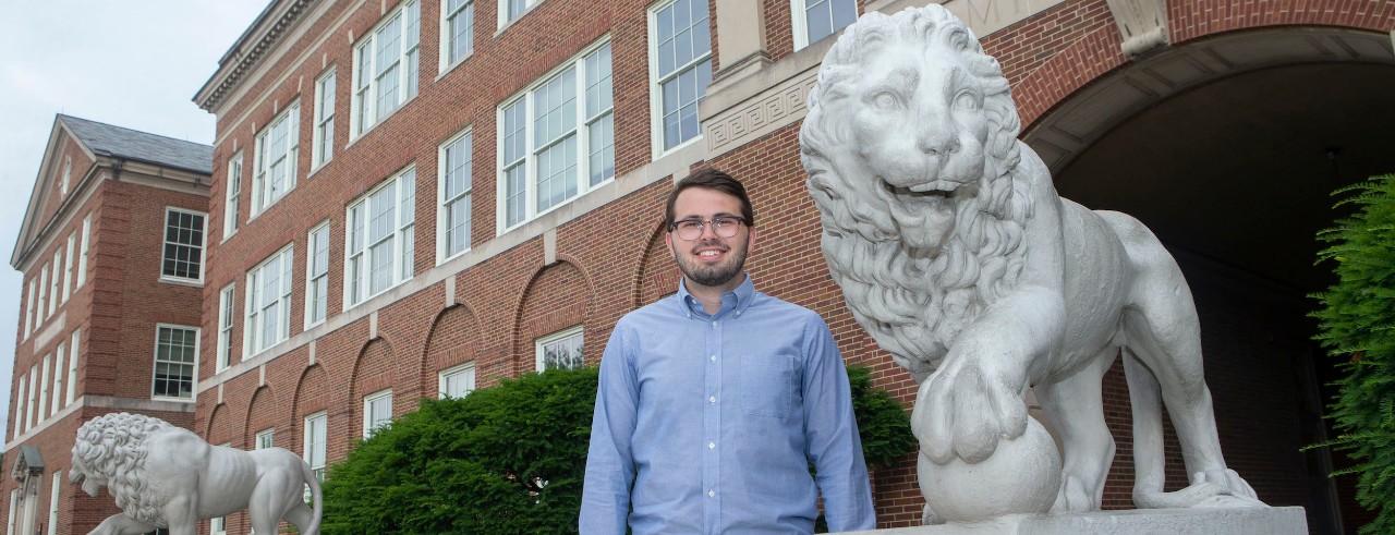 UC student stands by the Mick statue