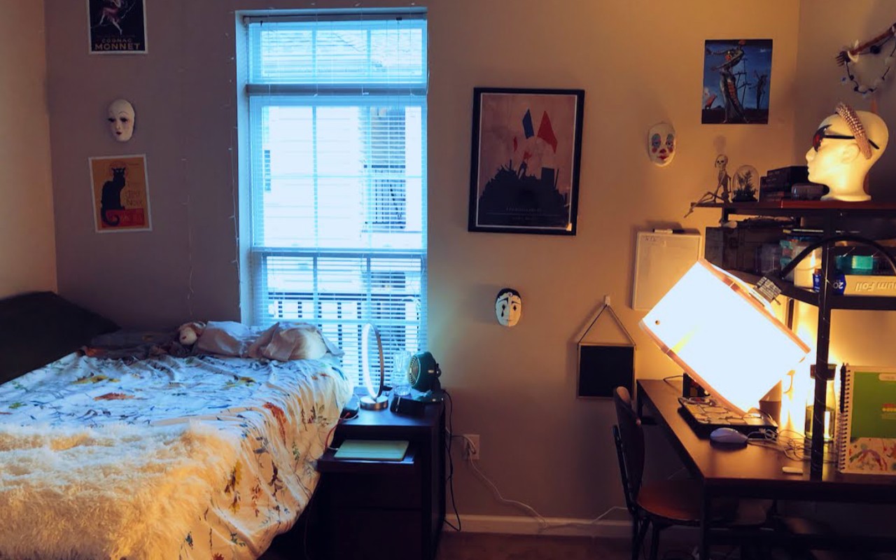 University Edge dorm room with bed and desk next to an open window
