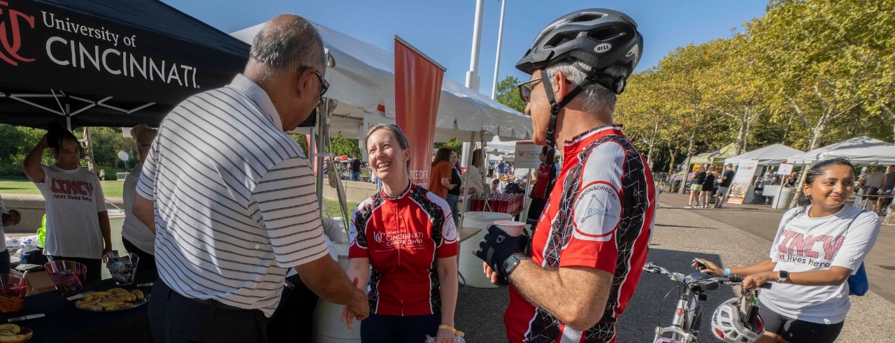 bicycle riders prepare for the start of the race at the start/finish line.